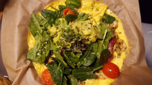 Omlette with herbs, spinach and cherry tomatos