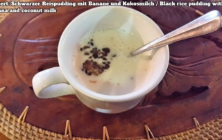 Bali Farm Cooking School. Black rice pudding with banana and coconut milk served in a cup with a spoon sticking in the pudding.