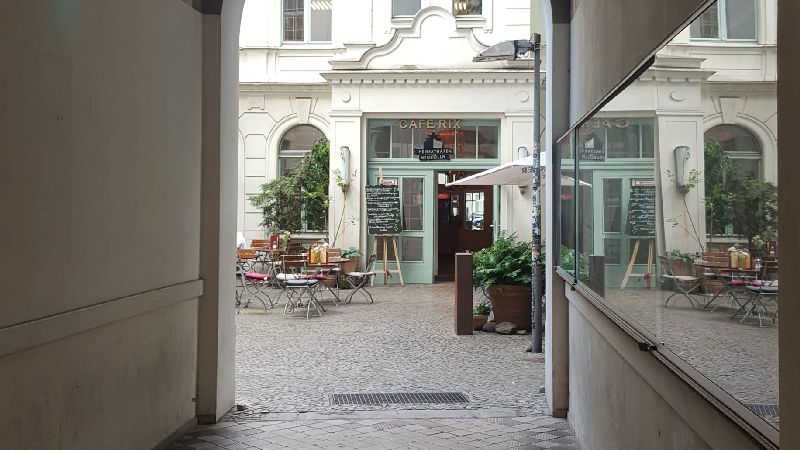 Café Rix. Gate passage and view into the courtyard.